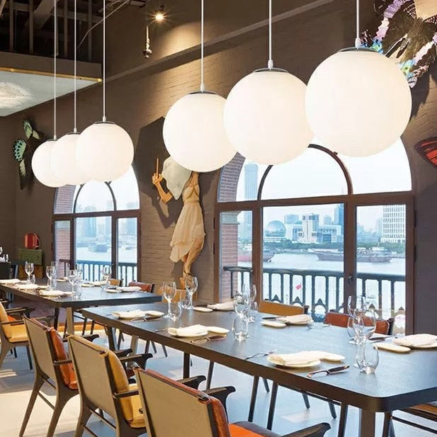 Makayla Elegance Meets Versatility: White Glass Globe Pendant