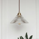 Enhance Your Dining Room With Industrial Elegance: The Brass Cone Pendant Clear Ribbed Glass