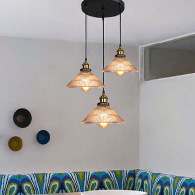 Illuminate Your Dining Room With Industrial Elegance: The 3 - Light Brass Cone Pendant Ribbed Glass