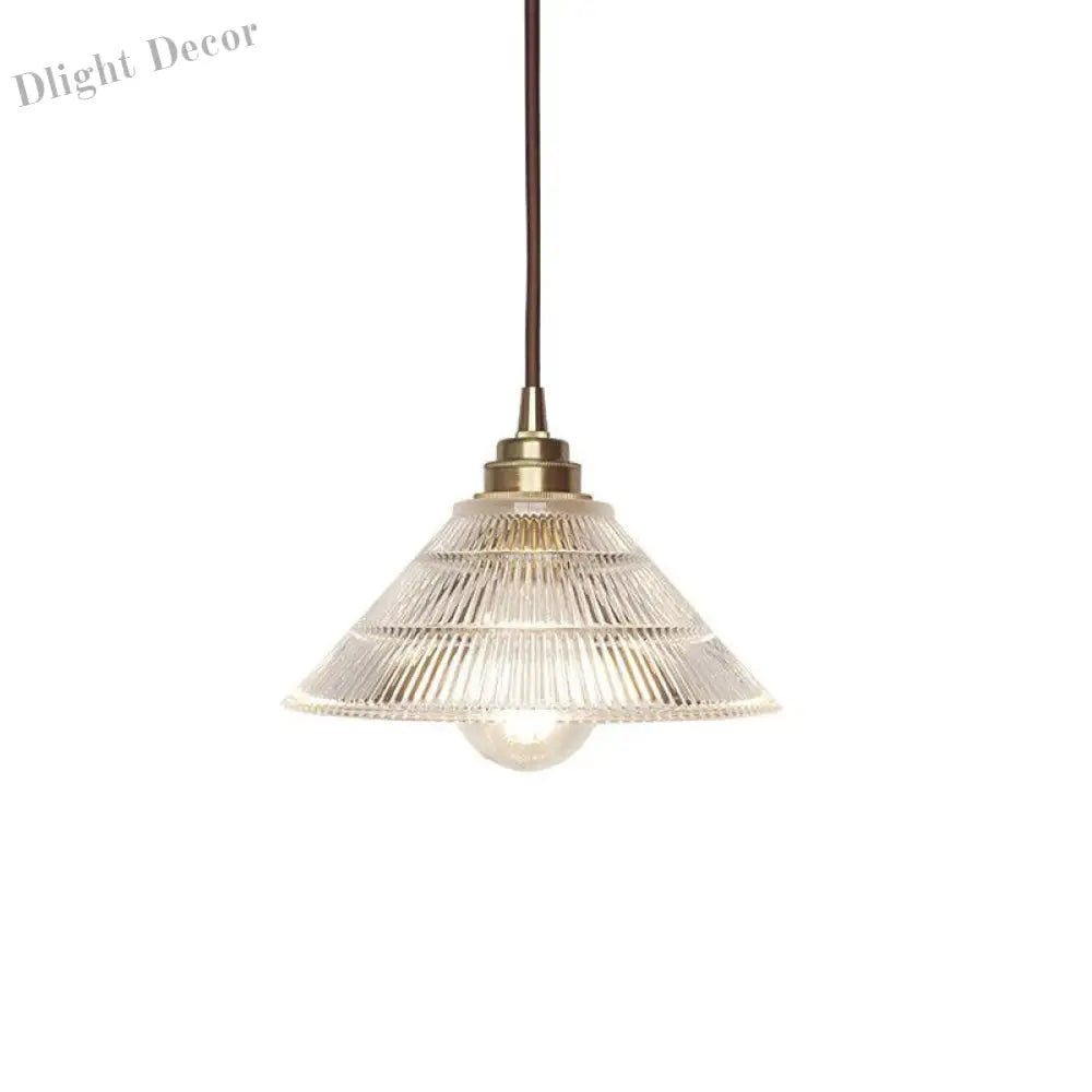 Enhance Your Dining Room With Industrial Elegance: The Brass Cone Pendant Clear Ribbed Glass