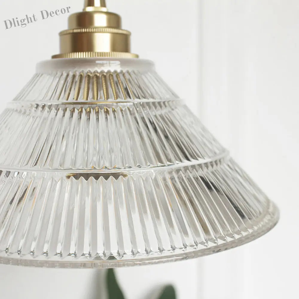 Enhance Your Dining Room With Industrial Elegance: The Brass Cone Pendant Clear Ribbed Glass