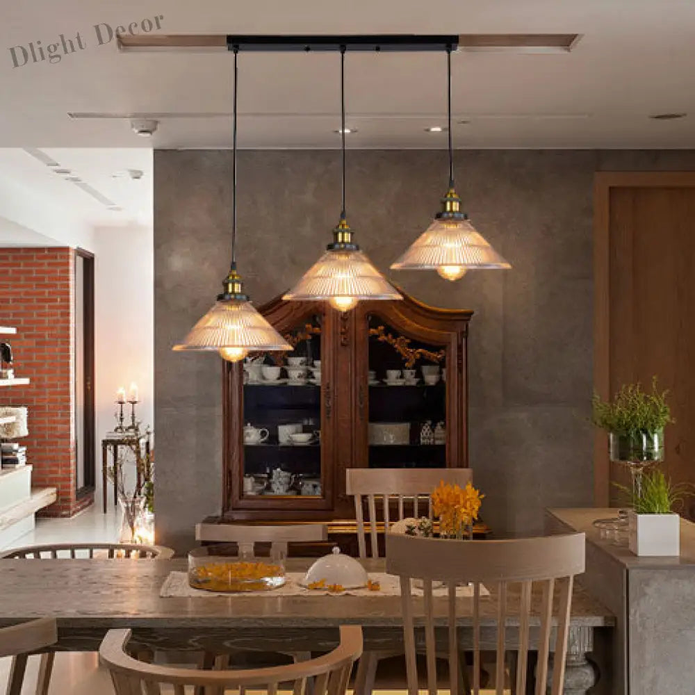 Illuminate Your Dining Room With Industrial Elegance: The 3 - Light Brass Cone Pendant Ribbed Glass