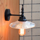 Light Up Your Space With Industrial Chic: The 1 - Light Black Sconce Clear/Green Glass Clear / Cone